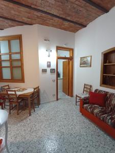 a living room with a couch and a table at Le Antiche Volte suite in Agropoli +42 photos