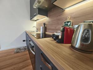a kitchen with a counter top with a tea kettle at Trilo Orologio in Clusone