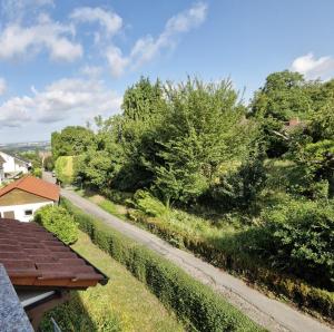 a view of a garden from the roof of a house at Ferienwohnung Sonnenschein in Weinheim
