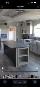 a kitchen with a large island in the middle at SLCa in Austin
