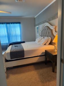 a bedroom with a large bed and a table at SLCa in Austin +6 photos
