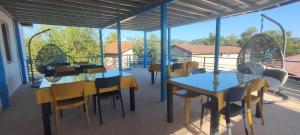 a group of tables and chairs on a patio at Neşe &Alp Apart Pansiyon in Demre