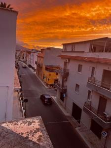 a view of a street with a car on the road at A due passi in Balestrate