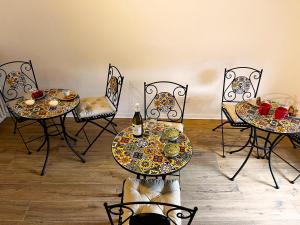a room with two tables and chairs with food on them at L'Una Dimora in Certaldo