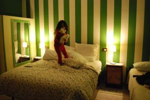 A bed or beds in a room at B&B L'Albero Di Antonia