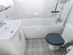 a white bathroom with a toilet and a sink at Keekle Terrace in Cleator Moor +22 photos
