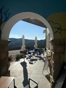 a view of a patio with tables and chairs at Hostal Don Santiago Ramon y Cajal in Petilla de Aragón