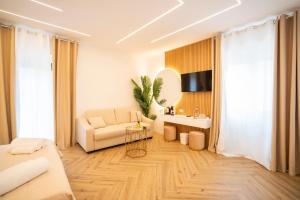 a living room with a couch and a table at Tropea Alto Borgo Rooms in Tropea