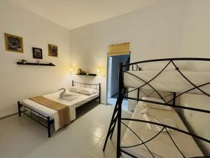 a bedroom with two bunk beds in a room at Kiriakos home in Agios Nikolaos
