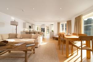 a living room with a couch and a table at Tors Park in Lynmouth