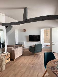 TV a/nebo společenská místnost v ubytování Appartement 2 chambres 5mn gare