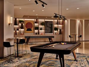 a billiard room with a pool table in the middle at Crowne Plaza Bratislava by IHG in Bratislava +93 photos