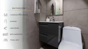 a bathroom with a white toilet and a sink at 602 Private Terrace apt AC Rooftop in Mexico City