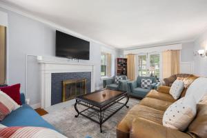 a living room with a couch and a fireplace at Private Room with Full Bed Cozy and Quiet in Peoria