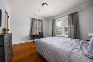 a bedroom with a bed and a desk and a window at Private Room with Full Bed Cozy and Quiet in Peoria