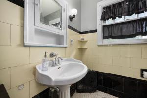 a bathroom with a sink and a mirror at Private Room with Full Bed Cozy and Quiet in Peoria +30 photos