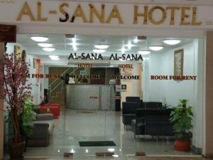 a santa ana hotel with chairs and a lobby at Alsana Hotel in Bangkok