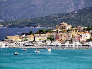 a group of boats in the water in a harbor at Résidence la Citadelle in Saint-Florent