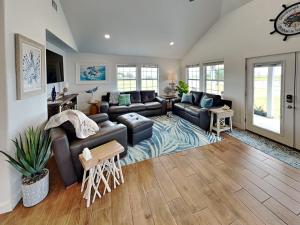 a living room with a couch and a table at Inn at Dolphin Bay in Rockport