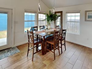 a dining room with a table and chairs at Inn at Dolphin Bay in Rockport