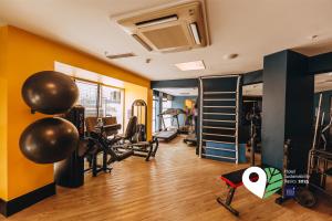 a gym with treadmills and exercise equipment in a room at Golden Tulip Natal Ponta Negra in Natal +49 photos