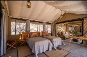 Voodi või voodid majutusasutuse Basecamp Samburu toas
