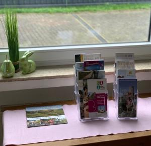 two boxes sitting on a table next to a window at FeWo Koch48 in Osann-Monzel