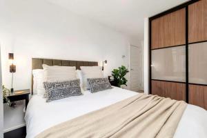 a bedroom with a large white bed with two pillows at NEW Berkley House by Truestays - 3 Bedroom House in Stoke-on-Trent in Etruria