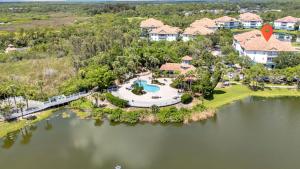 an aerial view of a house with a swimming pool at Vibrant 2br Apt Pool, Jacuzzi, Gym #11 in Tampa