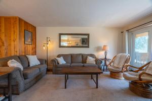 a living room with two couches and a table at Rr-interlaken 17 in June Lake