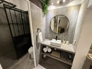 a bathroom with a sink and a mirror at Casa Verdejo - Zona Romantica in Puerto Vallarta +11 photos