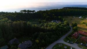 an aerial view of a house in a forest at Willa Świerkowa in Dębina