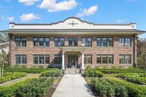 a brick school building with a pathway in front at The Adaline Room #5 - Upscale Hyde Park Apartment, 1st Floor, Steps to Bayshore in Tampa