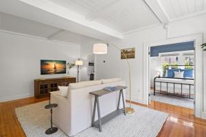 a living room with a couch and a table at The Adaline Room #5 - Upscale Hyde Park Apartment, 1st Floor, Steps to Bayshore in Tampa