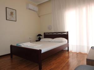 Ένα ή περισσότερα κρεβάτια σε δωμάτιο στο Ήσυχο και κεντρικό διαμέρισμα