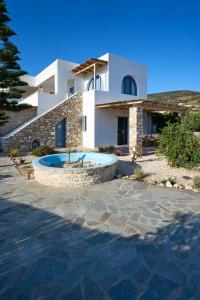 a house with a pool in front of it at La maison - Two Private Apartments, One with Private Pool in Angairiá