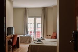 TV a/nebo společenská místnost v ubytování Hotel Traíña