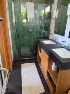 a bathroom with a glass shower with a sink and a shower at Magnifique villa pieds dans l eau Saint Jean Cap Ferrat in Saint-Jean-Cap-Ferrat +48 photos