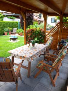 a table and chairs sitting on a patio at Harz und Gemütlich in Blankenburg +5 photos