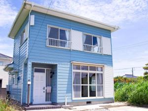 a blue house with a white door and windows at Sanbu-gun - House - Vacation STAY 77660v in Kujukuri