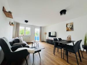 a living room with a couch and a table at Apartment Arjen in Pirna