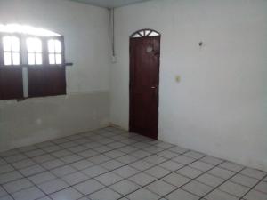 an empty room with a door and a tiled floor at Aluga-se para a cop30 in Ananindeua