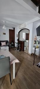 a living room with a couch and a table at Vivienda Rural Sentirte 1 Centro de Aracena in Aracena