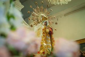 a woman in a costume holding an umbrella at Casa Erick in San Antonio