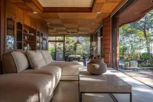 a living room with a couch and a large window at Villa Mille - Vacation STAY 19589 in Ito