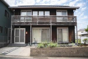 a house with a bike parked in front of it at sugi no ie - Vacation STAY 28169v in Awaji