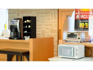 a microwave oven sitting on top of a counter at Hotel Symphony - Vacation STAY 85389v in Sagae