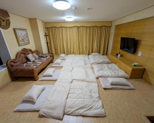 a large bed in a room with a couch at Nasu Green Onsen - Vacation STAY 19256 in Nasu-yumoto +37 photos