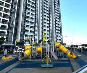 a playground in front of a large building at R&F Princess Cove Swimming View By TGW STUDIO in Johor Bahru