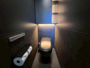 a small bathroom with a toilet and a light at TATEYAMA STUDIO - Vacation STAY 37918v in Tateyama +21 photos